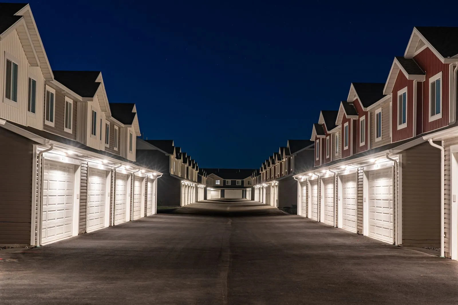 Townhomes with architectural accent lighting along the eaves