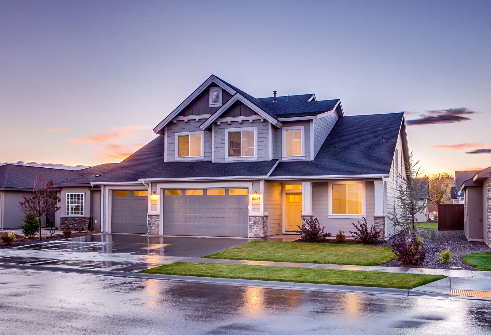 A home at dusk with permanent LED lighting picking out the rooflines